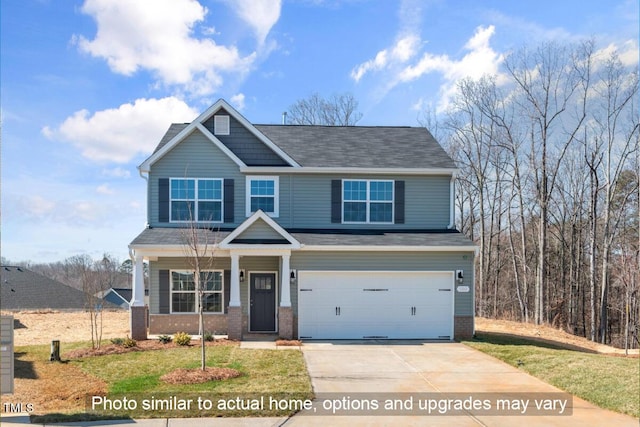 5504 Jaeger Dr Lot # 76, Graham, NC 27253 - craftsman inspired home with an attached garage, concrete driveway, brick siding, and a front lawn