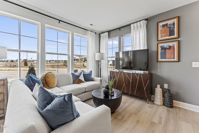 138 N White St # 100, Wake Forest, NC 27587 - living area featuring light wood finished floors and baseboards