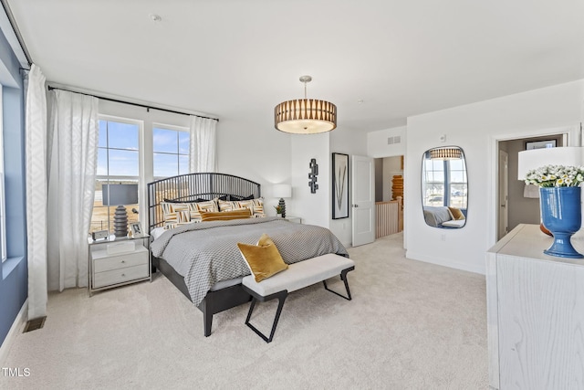 138 N White St # 100, Wake Forest, NC 27587 - bedroom with light carpet and baseboards