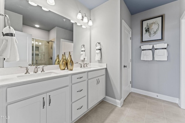 138 N White St # 100, Wake Forest, NC 27587 - full bath featuring double vanity, a shower stall, baseboards, and tile patterned floors