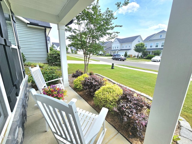 1412 Queen Trigger Dr, Fuquay Varina, NC 27526 - covered porch featuring a residential view and a lawn