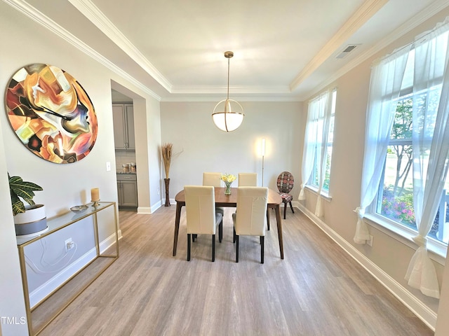 1412 Queen Trigger Dr, Fuquay Varina, NC 27526 - dining area featuring light wood-style floors, baseboards, and ornamental molding
