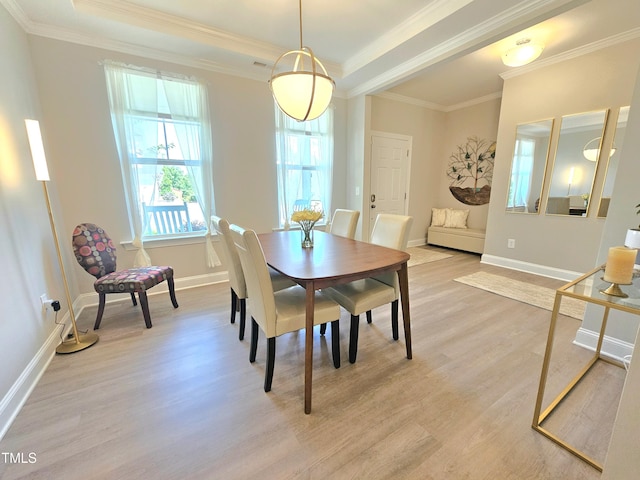 1412 Queen Trigger Dr, Fuquay Varina, NC 27526 - dining area with light wood-style flooring, crown molding, and baseboards