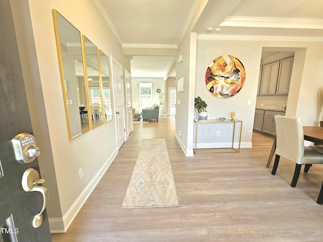 1412 Queen Trigger Dr, Fuquay Varina, NC 27526 - hallway with light wood-style flooring, crown molding, and baseboards