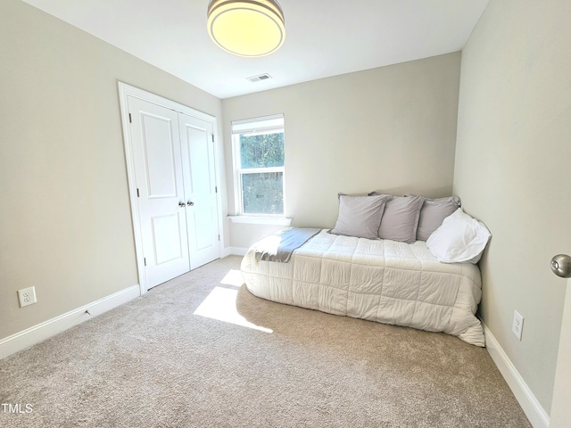 1412 Queen Trigger Dr, Fuquay Varina, NC 27526 - bedroom with carpet, baseboards, and a closet