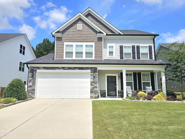 1412 Queen Trigger Dr, Fuquay Varina, NC 27526 - craftsman house with driveway, a front lawn, covered porch, stone siding, and a garage