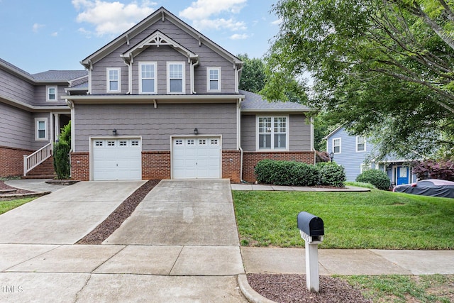 11005 Louson Pl, Raleigh, NC 27614 - view of front of house with brick siding, a front yard, an attached garage, and concrete driveway