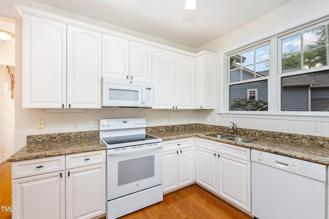 11005 Louson Pl, Raleigh, NC 27614 - kitchen featuring white appliances, a sink, light wood-type flooring, and white cabinets