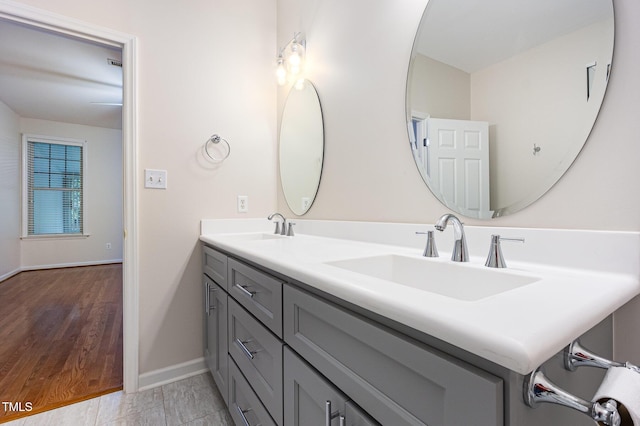 11005 Louson Pl, Raleigh, NC 27614 - bathroom featuring double vanity and baseboards