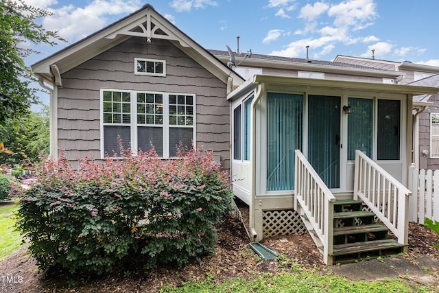 11005 Louson Pl, Raleigh, NC 27614 - back of house featuring a sunroom and entry steps