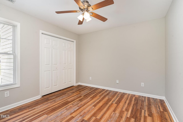 5437 Advantis Dr, Raleigh, NC 27610 - unfurnished bedroom featuring wood finished floors, baseboards, and a closet