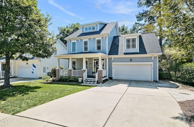 908 Town Side Dr, Apex, NC 27502 - view of front facade featuring a porch, a front yard, a shingled roof, driveway, and a garage