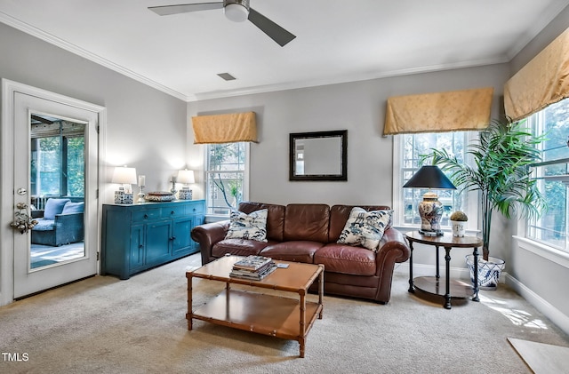 908 Town Side Dr, Apex, NC 27502 - living area with plenty of natural light, light carpet, ornamental molding, and a ceiling fan