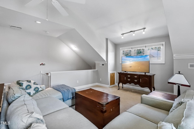 908 Town Side Dr, Apex, NC 27502 - living area featuring a ceiling fan, carpet, baseboards, and vaulted ceiling