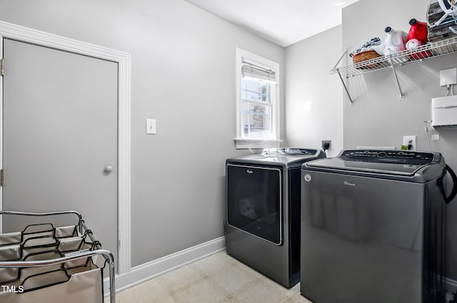 908 Town Side Dr, Apex, NC 27502 - laundry room with washing machine and dryer, light flooring, and baseboards