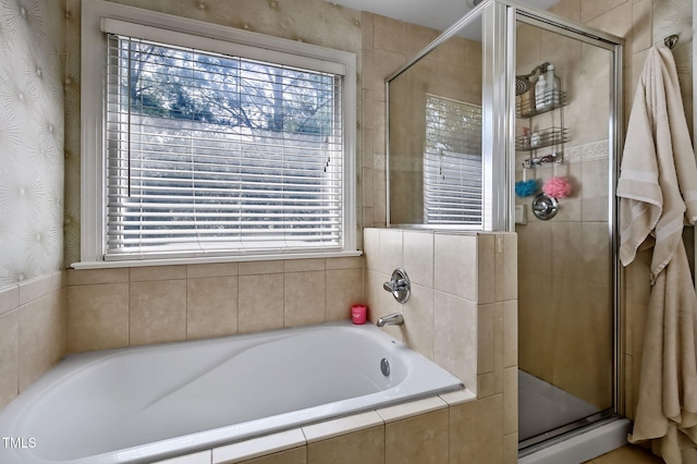 908 Town Side Dr, Apex, NC 27502 - full bathroom with healthy amount of natural light, a shower stall, a bath, and wallpapered walls