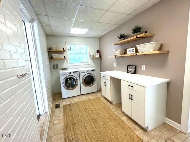 11609 US-401, Fuquay Varina, NC 27526 - laundry room featuring washer and clothes dryer and cabinet space
