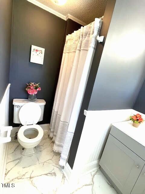 11609 US-401, Fuquay Varina, NC 27526 - bathroom with toilet, marble finish floors, curtained shower, and crown molding