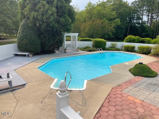 11609 US-401, Fuquay Varina, NC 27526 - view of pool featuring a fenced backyard and a patio