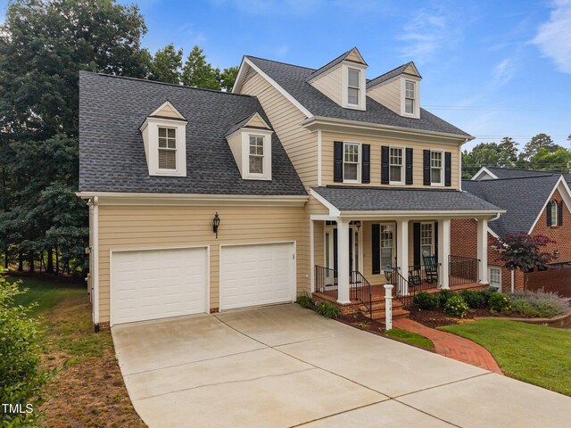 1412 Kings Lassiter Way, Raleigh, NC 27614 - view of front of home featuring covered porch, roof with shingles, driveway, and a front lawn