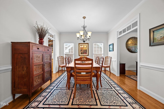 1412 Kings Lassiter Way, Raleigh, NC 27614 - dining space with a chandelier, light wood-type flooring, ornamental molding, and baseboards