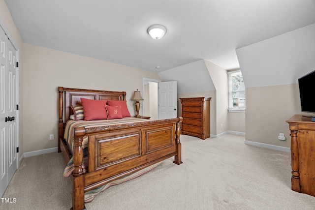 1412 Kings Lassiter Way, Raleigh, NC 27614 - bedroom with light colored carpet, baseboards, and lofted ceiling