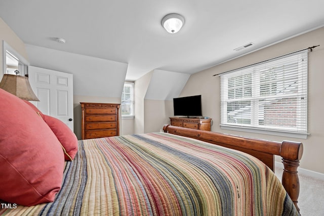 1412 Kings Lassiter Way, Raleigh, NC 27614 - carpeted bedroom featuring lofted ceiling and baseboards