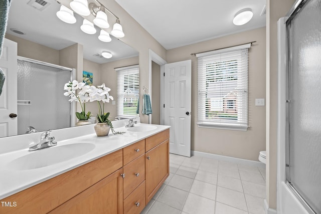 1412 Kings Lassiter Way, Raleigh, NC 27614 - full bath featuring an enclosed shower, double vanity, baseboards, tile patterned floors, and healthy amount of natural light