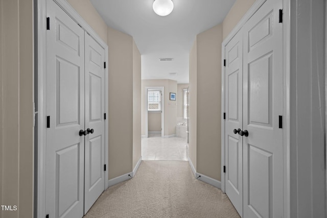 1412 Kings Lassiter Way, Raleigh, NC 27614 - corridor with baseboards and light carpet