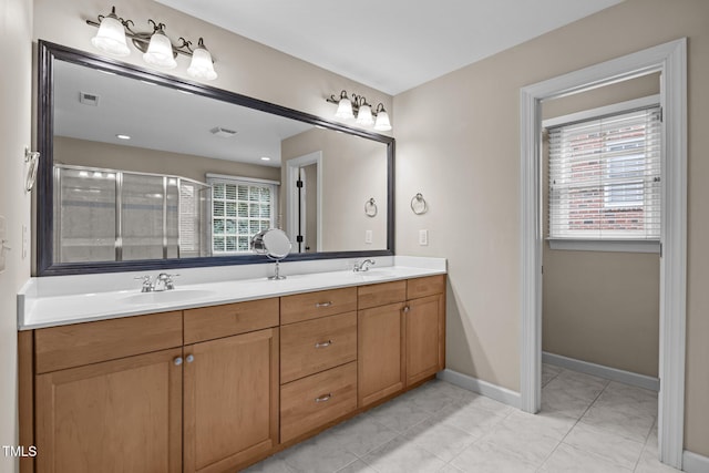 1412 Kings Lassiter Way, Raleigh, NC 27614 - full bathroom with double vanity, a shower stall, tile patterned flooring, and baseboards