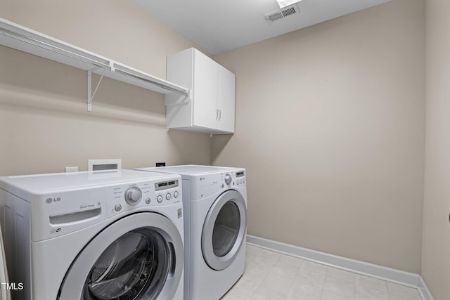 1412 Kings Lassiter Way, Raleigh, NC 27614 - laundry room with washer and dryer, cabinet space, and baseboards