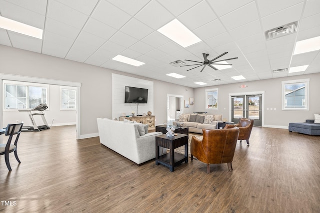 797 S Wilma St, Angier, NC 27501 - living area with dark wood finished floors, a ceiling fan, a paneled ceiling, and plenty of natural light