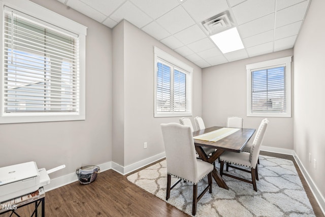 797 S Wilma St, Angier, NC 27501 - dining area featuring healthy amount of natural light, wood finished floors, baseboards, and a paneled ceiling