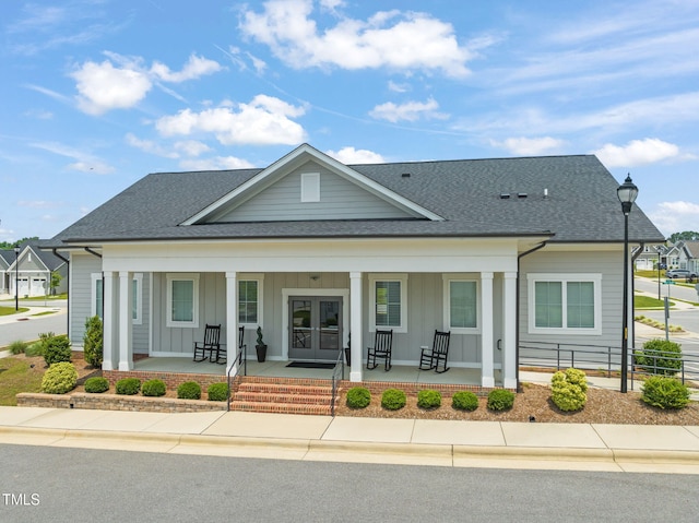 797 S Wilma St, Angier, NC 27501 - view of front of home featuring a porch, board and batten siding, a shingled roof, and french doors