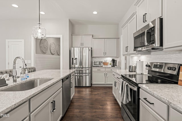 797 S Wilma St, Angier, NC 27501 - kitchen with appliances with stainless steel finishes, a sink, decorative backsplash, white cabinets, and recessed lighting