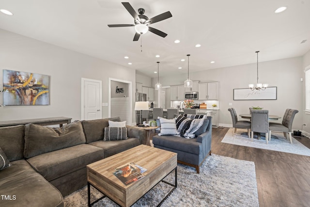 797 S Wilma St, Angier, NC 27501 - living area with ceiling fan, dark wood-type flooring, recessed lighting, a chandelier, and baseboards