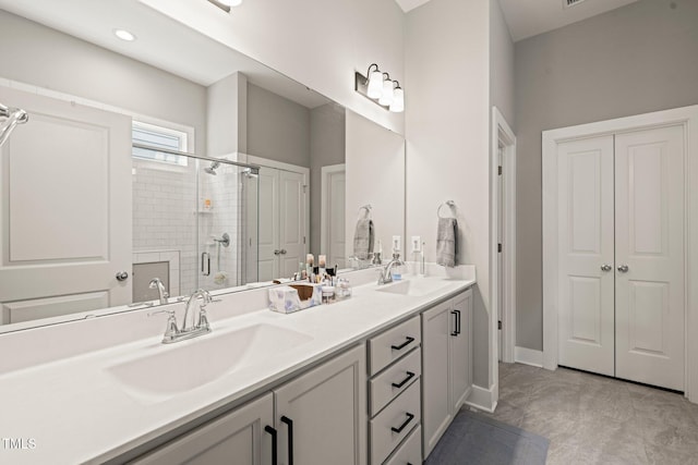 797 S Wilma St, Angier, NC 27501 - bathroom featuring double vanity, a shower stall, and baseboards
