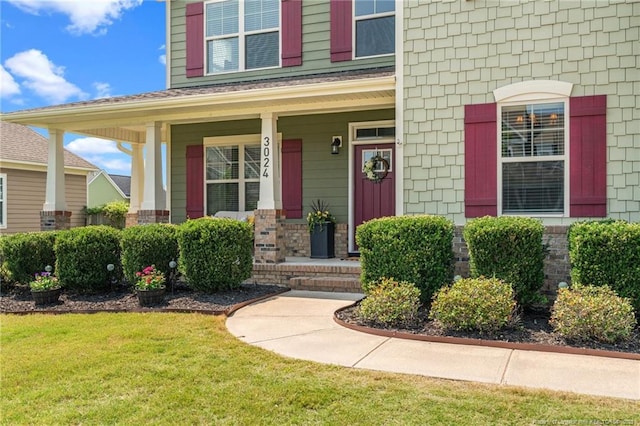 3024 Eagle Crest Ln, Fayetteville, NC 28306 - doorway to property featuring covered porch and a yard