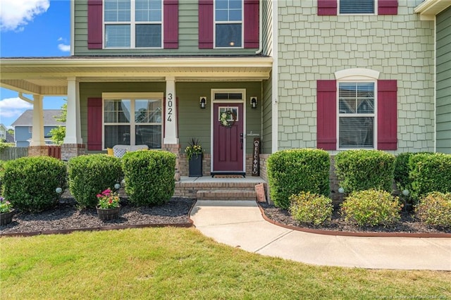 3024 Eagle Crest Ln, Fayetteville, NC 28306 - entrance to property with covered porch and a lawn