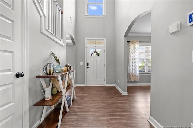 3024 Eagle Crest Ln, Fayetteville, NC 28306 - foyer with arched walkways, a towering ceiling, wood finished floors, baseboards, and ornamental molding