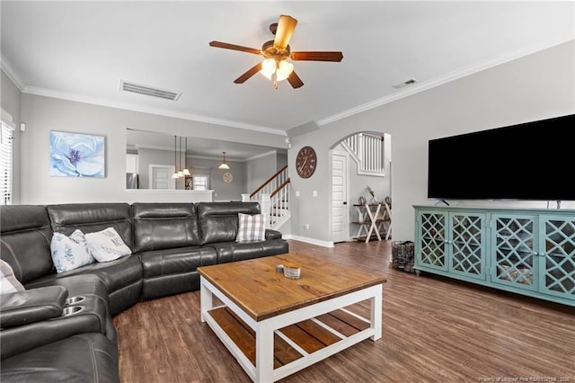 3024 Eagle Crest Ln, Fayetteville, NC 28306 - living area featuring arched walkways, a ceiling fan, stairs, ornamental molding, and wood finished floors