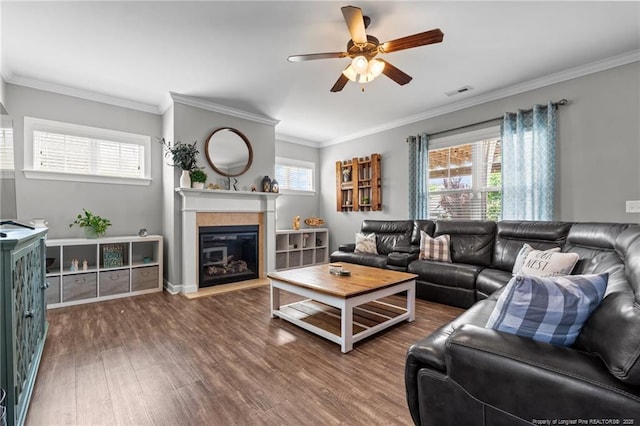3024 Eagle Crest Ln, Fayetteville, NC 28306 - living room with wood finished floors, ceiling fan, healthy amount of natural light, a fireplace with flush hearth, and ornamental molding