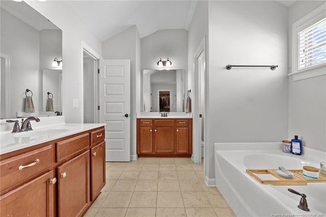 3024 Eagle Crest Ln, Fayetteville, NC 28306 - full bath with tile patterned flooring, vanity, a garden tub, and vaulted ceiling