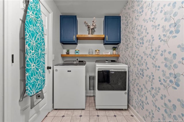3024 Eagle Crest Ln, Fayetteville, NC 28306 - laundry room featuring cabinet space, wallpapered walls, independent washer and dryer, and light tile patterned floors