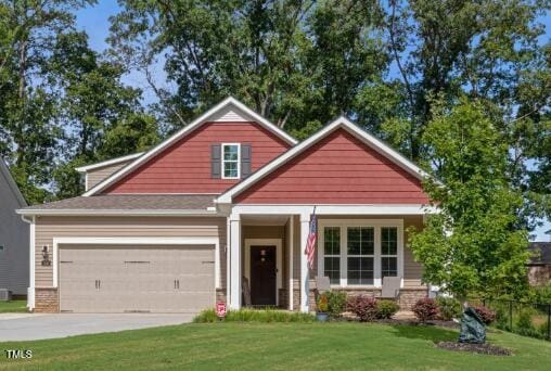 100 Pronghorn Deer Ct, Garner, NC 27529 - craftsman inspired home featuring a front yard, concrete driveway, and a garage