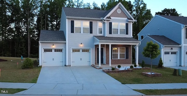 391 Curling Crk Dr, Clayton, NC 27527 - traditional home featuring a porch, driveway, a front lawn, and roof with shingles