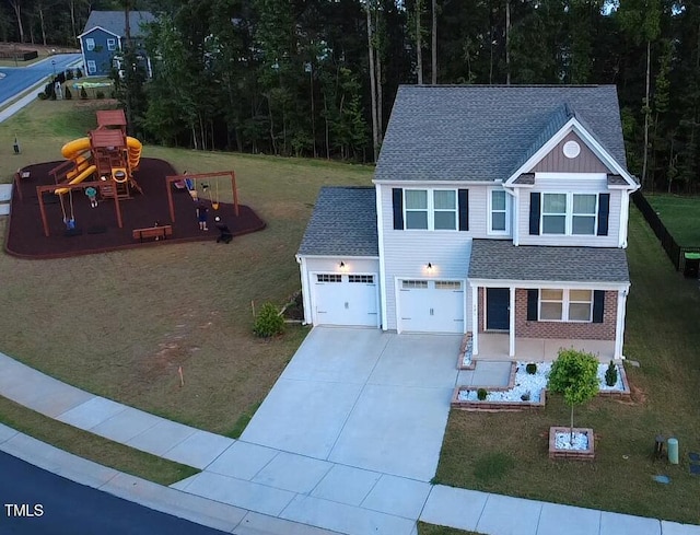 391 Curling Crk Dr, Clayton, NC 27527 - view of front of property with roof with shingles, driveway, a front yard, and an attached garage
