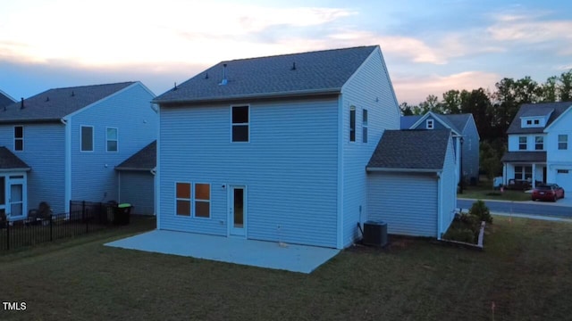 391 Curling Crk Dr, Clayton, NC 27527 - back of house at dusk with a patio area and central air condition unit