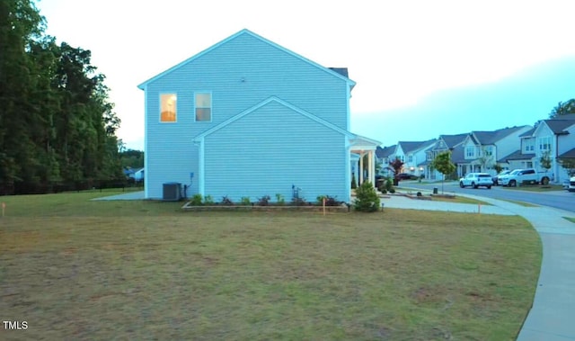 391 Curling Crk Dr, Clayton, NC 27527 - view of home's exterior featuring a lawn, central AC, and a residential view