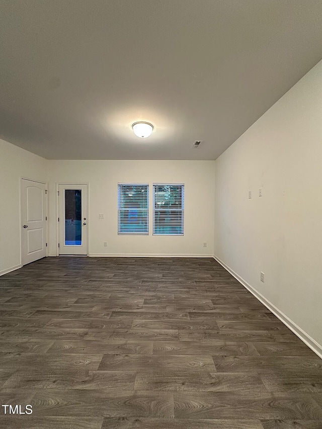 391 Curling Crk Dr, Clayton, NC 27527 - unfurnished room featuring dark wood-type flooring and baseboards